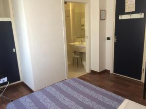 Postel nebo postele na pokoji v ubytování Hotel Nettuno