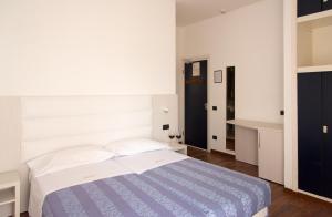 Postel nebo postele na pokoji v ubytování Hotel Nettuno