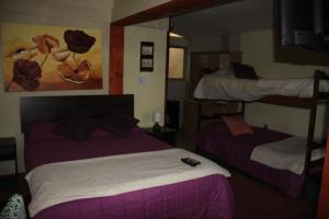 Ein Bett oder Betten in einem Zimmer der Unterkunft Hostal Los Guindos