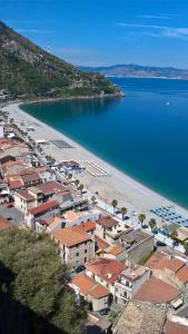 an aerial view of a beach with buildings and the water at Stop And Go in Scilla