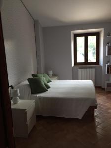 Ein Bett oder Betten in einem Zimmer der Unterkunft Villa delle Fonti di Portonovo