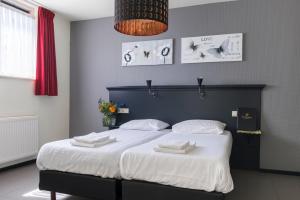 Postel nebo postele na pokoji v ubytování Hotel De Kruishoeve 's-Hertogenbosch - Vught