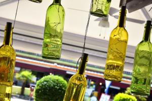 a group of glass bottles hanging from a ceiling at Hotel Ristorante Fortuna in Cavallino-Treporti