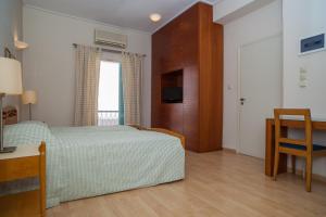 Postel nebo postele na pokoji v ubytování Hotel Saron