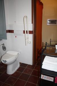 a bathroom with a toilet and a sink at Cà Veja in Montà