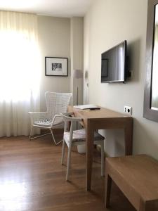 TV a/nebo společenská místnost v ubytování Hotel Entredos