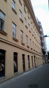 a large building with windows on the side of a street at Beautiful Central Apartment Thámova in Prague