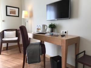 TV a/nebo společenská místnost v ubytování Hotel Entredos