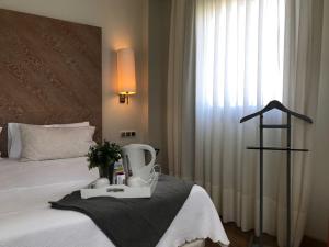 Postel nebo postele na pokoji v ubytování Hotel Entredos