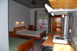 a small room with two beds and a kitchen at Dimitris Apartments in Vasiliki +19 photos