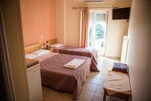 Posteľ alebo postele v izbe v ubytovaní Zoumboulis Rooms