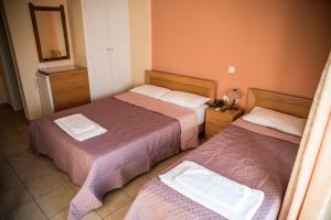 Posteľ alebo postele v izbe v ubytovaní Zoumboulis Rooms