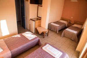 Posteľ alebo postele v izbe v ubytovaní Zoumboulis Rooms
