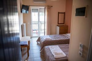 Posteľ alebo postele v izbe v ubytovaní Zoumboulis Rooms