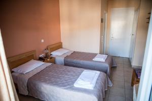 Posteľ alebo postele v izbe v ubytovaní Zoumboulis Rooms