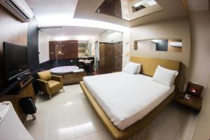 Katil atau katil-katil dalam bilik di Villa Verde Motel (Adults Only)