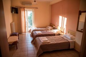 Posteľ alebo postele v izbe v ubytovaní Zoumboulis Rooms