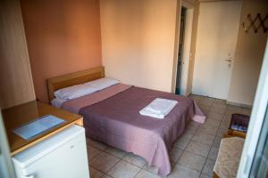 Posteľ alebo postele v izbe v ubytovaní Zoumboulis Rooms