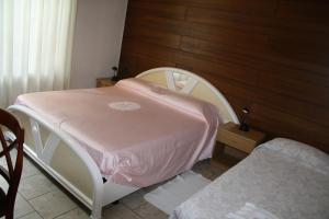 Letto o letti in una camera di Albergo Stazione