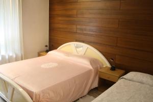 Letto o letti in una camera di Albergo Stazione