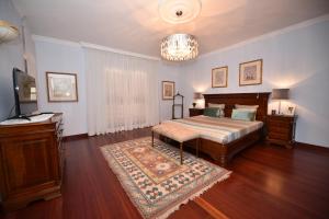 Cama ou camas em um quarto em Villa Santana