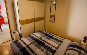 Postel nebo postele na pokoji v ubytování Apartments & Room Toni
