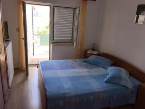 Postel nebo postele na pokoji v ubytování Apartment Nela