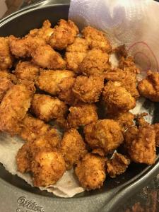 a pan filled with fried chicken in a pan at The Destination B&B llc in Salem