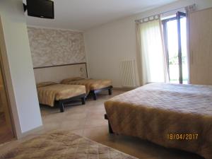 Postel nebo postele na pokoji v ubytování Agritur Arcosole B&B Camping + 37 fotografií