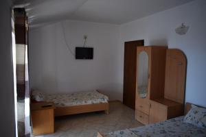 Postel nebo postele na pokoji v ubytování Apartmani Alex Beach