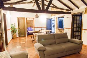 a living room with a couch and a table at Cabaña NIDO VERDE in Iza