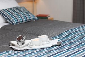 Posteľ alebo postele v izbe v ubytovaní Hotel Perła
