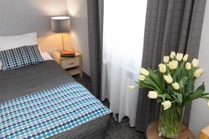 Posteľ alebo postele v izbe v ubytovaní Hotel Perła