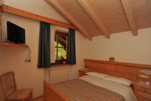 Postel nebo postele na pokoji v ubytování Albergo Garni' Laura + 37 fotografií