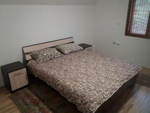 A bed or beds in a room at Apartment Sijakovic