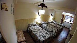 Cama ou camas em um quarto em Rosa De Los Vientos