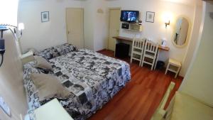Cama ou camas em um quarto em Rosa De Los Vientos