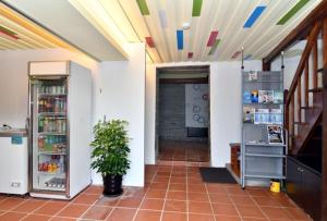 a hallway of a building with a refrigerator at Chinbe D.S House B&B in Beigan