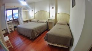 Cama ou camas em um quarto em Rosa De Los Vientos