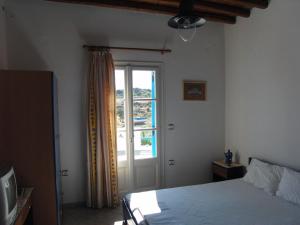 Postel nebo postele na pokoji v ubytování Smaragda Rooms & Studios