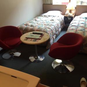 Postel nebo postele na pokoji v ubytování Oka Hotel