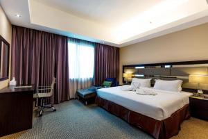 Postel nebo postele na pokoji v ubytování Ixora Hotel Penang