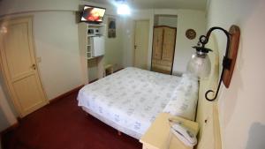 Cama ou camas em um quarto em Rosa De Los Vientos