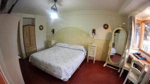 Cama ou camas em um quarto em Rosa De Los Vientos
