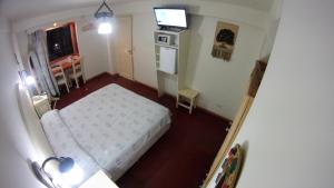 Cama ou camas em um quarto em Rosa De Los Vientos