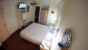Cama ou camas em um quarto em Rosa De Los Vientos