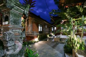 a courtyard of a house with trees and plants at The Jero Ubud in Ubud