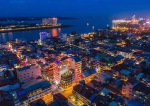 an aerial view of a city at night at SUN & MOON, Urban Hotel in Phnom Penh