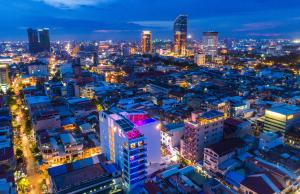 a view of a city at night at SUN & MOON, Urban Hotel in Phnom Penh