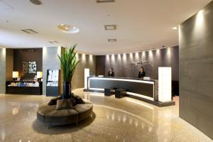 a lobby of a hotel with a reception desk at Hotel Sardonyx Tokyo in Tokyo